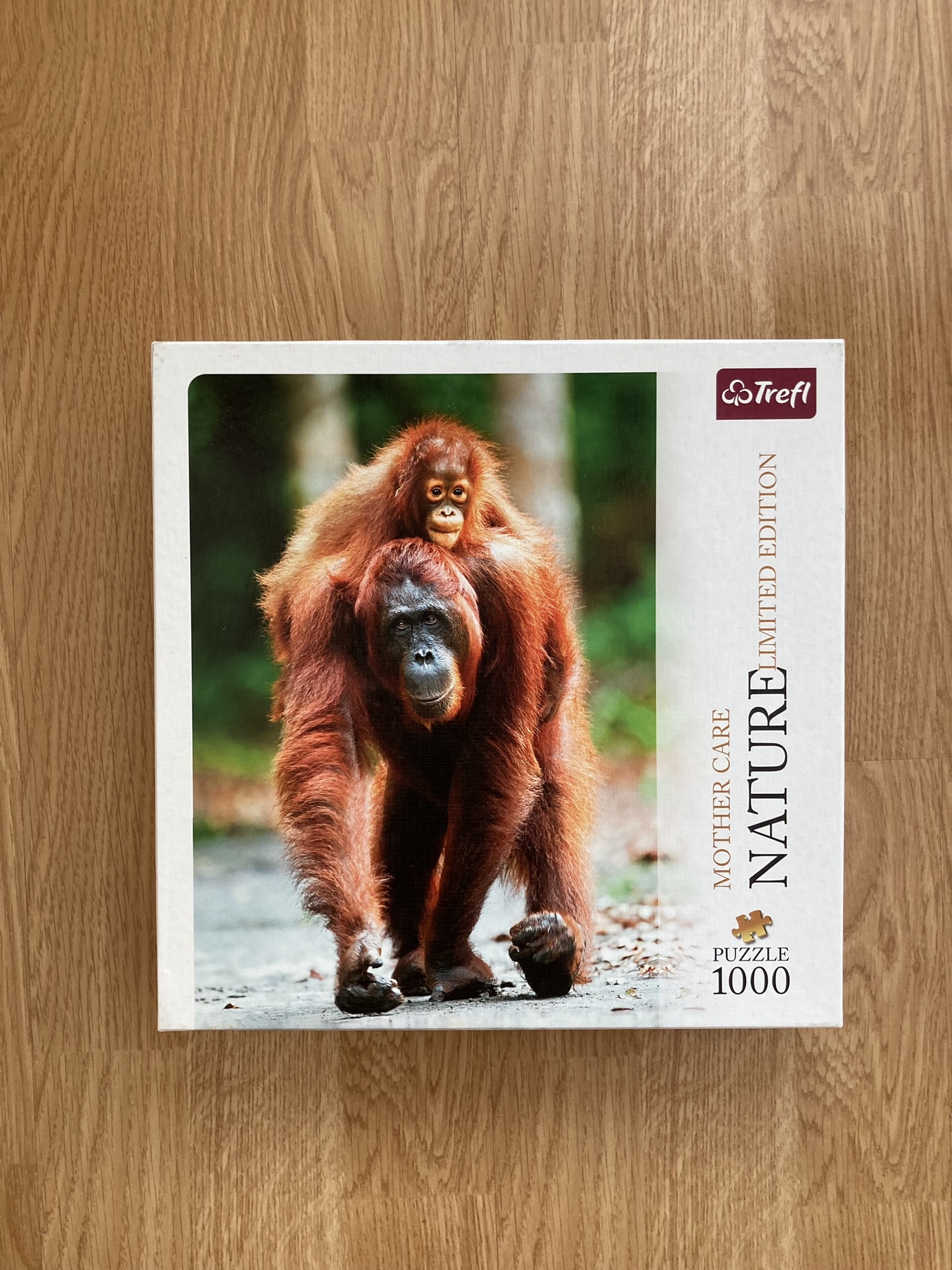 Puzzle Trefl 1000 "Mother Care - Orangutan"